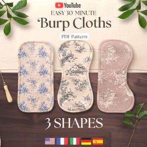 May include: Three burp cloths with distinct shapes and fabric patterns, including blue floral, black and white landscape, and mauve floral designs. The text reads YouTube EASY 30-MINUTE Burp Cloths PDF Pattern 3 SHAPES with five national flags below.