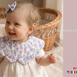 May include: A smiling baby wearing a white dress and a bib with a blue floral pattern. A matching bow is in the baby's hair. The text "Elegant Collar Inspired Design" is visible. A YouTube tutorial is also advertised.