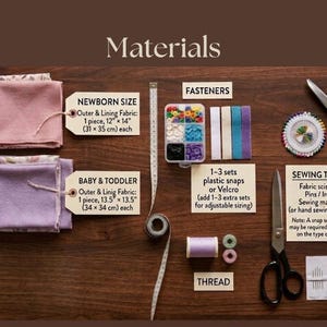 May include: A collection of sewing materials, including fabric, fasteners, thread, and sewing tools. The image shows fabric pieces for newborn and baby/toddler sizes, measuring 12" x 14" and 13.5" x 13.5" respectively. Also included are scissors, pins, and an iron.