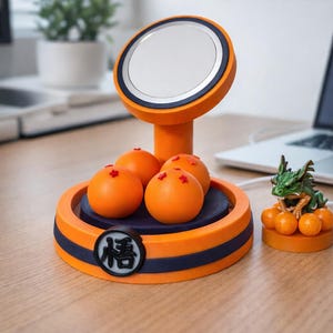 May include: An orange and blue decorative stand with a mirror, four orange spheres, and a small green dragon figurine. The stand has a circular base with a Japanese symbol and a blue stripe.