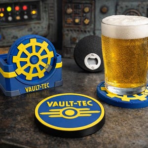 May include: A glass of beer with a foamy head sits on a blue and yellow Vault-Tec coaster. Other Vault-Tec themed items include a coaster, a bottle opener, and a figurine. The items are on a dark, textured surface.