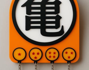 May include: Orange key holder with a black and white design featuring a Japanese symbol and four yellow circles with red stars. Each circle has a silver key ring attached.