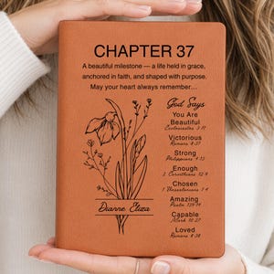 May include: A tan leather-bound journal with the text "CHAPTER 37" and inspirational quotes. The cover features a floral design and the name "Dianne Eliza". A thoughtful gift.