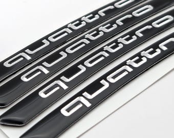 Pegatinas para llantas Quattro en negro brillante - Emblema Audi (4 unidades, 7 x 90 mm)