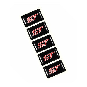 May include: Five black rectangular emblems featuring the letters "ST" in red and white. The emblems are arranged vertically against a white backdrop. The "ST" logo is in a bold, stylized font.