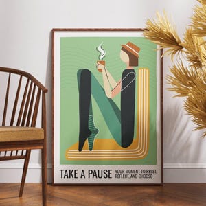 May include: A framed art print with a minimalist illustration of a person holding a steaming cup. The figure is seated, with legs forming the letter "N". The artwork features a green background and the text "TAKE A PAUSE".