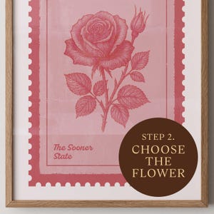May include: A framed print featuring a detailed illustration of a pink rose with a bud and leaves. The artwork is set against a pink background with a postage stamp design. Text includes "The Sooner State" and "Step 2. Choose the Flower."