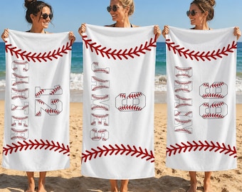 May include: Three white rectangular beach towels featuring a red baseball stitch pattern across the top and bottom. Each towel displays a personalized name and number in a block font filled with a red baseball stitch graphic design.
