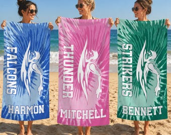 May include: Three rectangular beach towels featuring a tie-dye pattern in blue, pink, and green. Each towel displays a white graphic of a stylized figure and text: FALCONS HARMON, THUNDER MITCHELL, and STRIKERS BENNETT in white block letters.