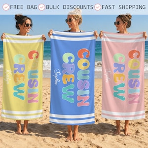 May include: Three rectangular beach towels in yellow, blue, and pink, each featuring the text COUSIN CREW in colorful bubble letters and a personalized name printed vertically on the side, with white horizontal stripes at the top and bottom edges.