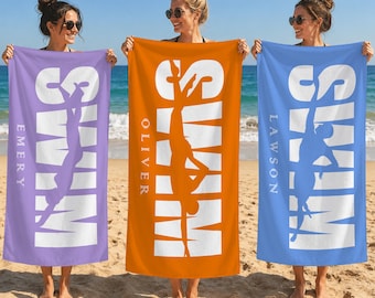May include: Three rectangular beach towels in lavender, orange, and blue. Each towel features the word SWIM in large white letters with a silhouette of a swimmer integrated into the design. The names EMERY, OLIVER, and LAWSON are printed vertically.