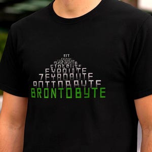 May include: Black t-shirt with a white and green graphic. The design includes the word "BRONTBYTE" in green, with other text stacked above it. The shirt is made of a soft material.