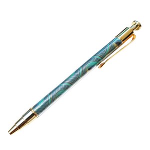 May include: A decorative pen with a teal and gold peacock feather design. The pen has a gold clip and accents. The pen is a writing instrument.