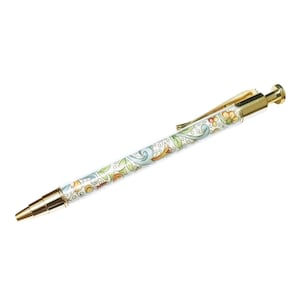 May include: A decorative pen with a gold-colored tip, clip, and end. The pen's barrel is white with a colorful floral design in green, blue, orange, and yellow. The pen is a writing instrument.