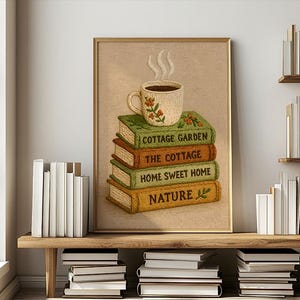 May include: A framed print depicting a stack of books with the titles "Cottage Garden," "The Cottage," "Home Sweet Home," and "Nature." A floral-decorated coffee cup with steam sits on top. The artwork has a warm, inviting colour palette.