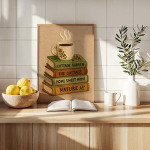 May include: A framed print depicting a stack of books with the titles "Cottage Garden", "The Cottage", "Home Sweet Home", and "Nature". A steaming cup of coffee rests on the books. A bowl of lemons, a vase with greenery, and an open book are also present.