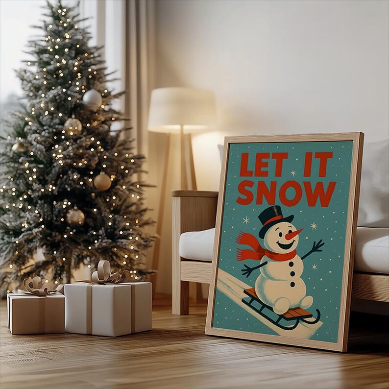 May include: A framed print featuring a vintage illustration of a snowman on a sled, with the words "LET IT SNOW" in red. The snowman wears a black top hat and a red scarf. The background is teal with white stars.