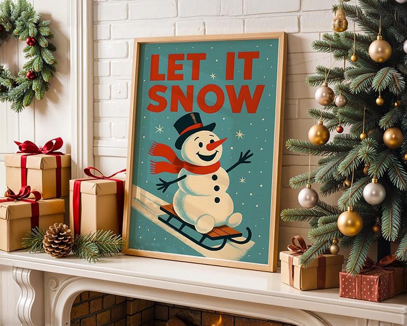 May include: A framed print featuring a snowman on a sled, with the words "LET IT SNOW" in red. The snowman is wearing a black top hat and a red scarf. The print is on a white mantelpiece with Christmas decorations.