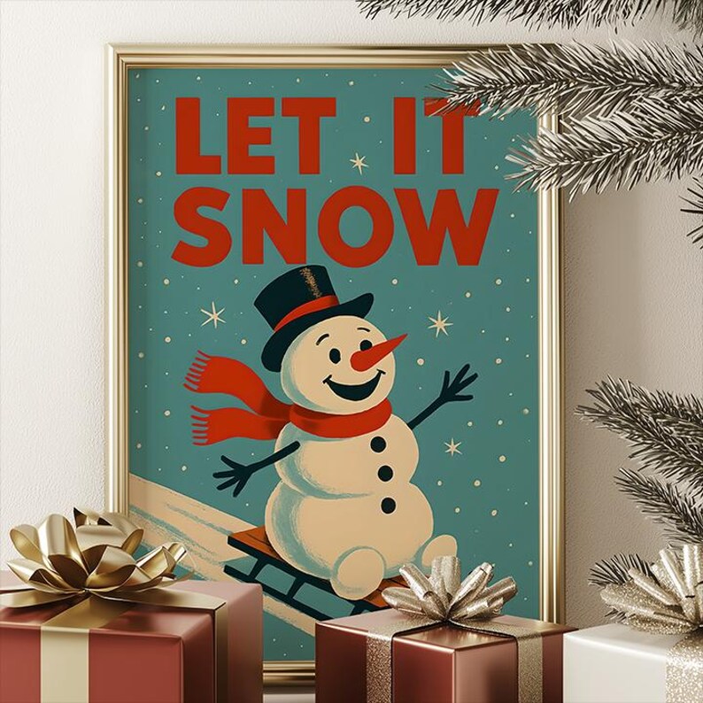 May include: A framed print with the words "LET IT SNOW" in red. The image shows a snowman in a black top hat and red scarf, on a sled. The background is teal with white snowflakes. Presents with gold bows are in the foreground.