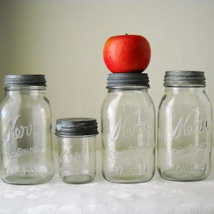 vintage canning jars, zinc metal lids, Kerr mason fruit bottles, clear glass pantry collectible storage containers, food preservation gift