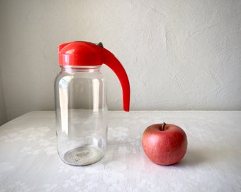 vintage glass syrup pitcher jar with red lid and handle, Anchor Hocking