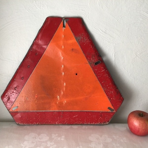 orange triangle sign, slow moving vehicle, vintage farm original, tractor implement, reflective metal caution symbol, industrial decor gift