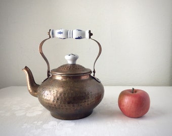 Copper tea kettle, blue and white porcelain handle, hammered metal teapot