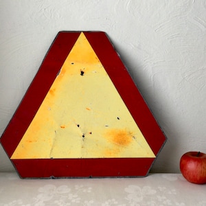 orange slow moving vehicle sign, vintage farm tool, reflective triangle shape caution alert, industrial decor gift, metal danger signal