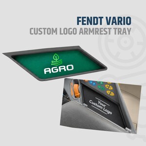 May include: A Fendt Vario custom logo armrest tray featuring a trapezoidal shape with a green surface and the white text AGRO. A second view shows the tray installed in a vehicle console with the white text Your Custom Logo on a black surface.