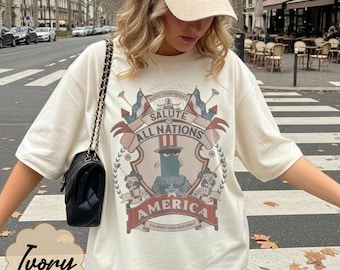 Komfortfarben Ein Gruß an alle Völker, aber hauptsächlich Amerika Shirt, Sam The Eagle T-Shirt, Vaterländisches Disney World T-Shirt, 4. Juli Epcot Shirt