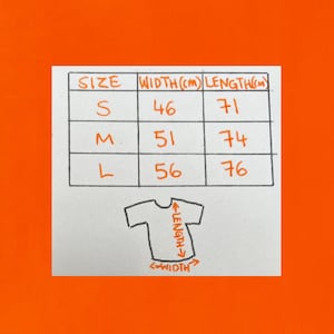 May include: A handwritten size chart for a t-shirt, with measurements in centimeters. Sizes include S, M, and L, with corresponding widths and lengths. A small t-shirt graphic illustrates width and length measurements.