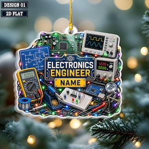 May include: A decorative ornament featuring an electronics engineer theme with a central sign reading ELECTRONICS ENGINEER NAME. The design includes a digital multimeter, oscilloscope, power supply, breadboard, circuit board, and soldering iron, all surrounded by colorful string lights.