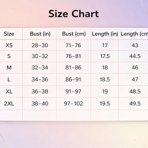 May include: A size chart with measurements in inches and centimetres. The chart includes sizes XS to 2XL, with bust measurements ranging from 28-40 inches (71-102 cm) and lengths from 17-19.5 inches (43-49.5 cm). The text "Size Chart" is at the top.