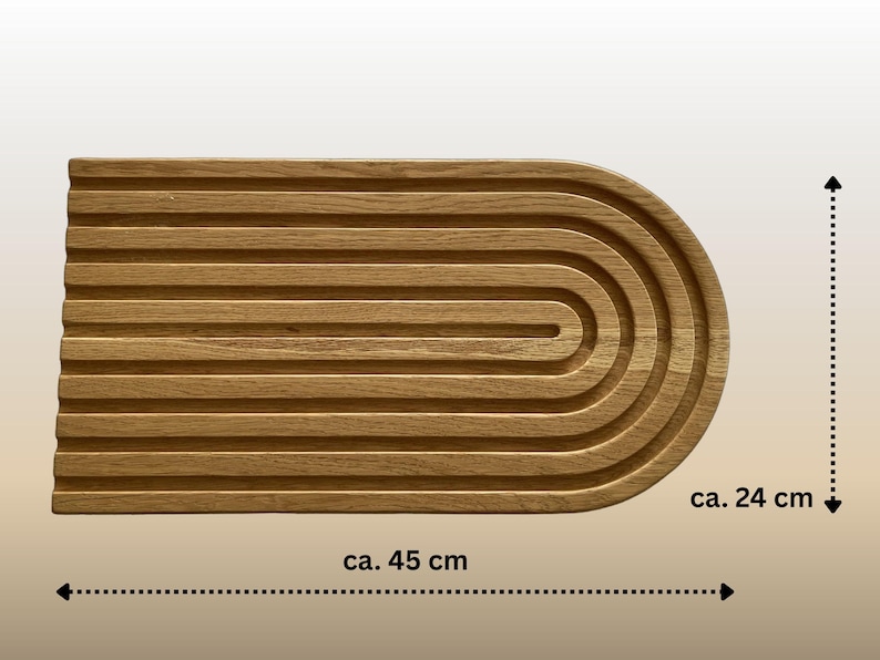 May include: A wooden serving tray with a grooved surface and a rounded end. The tray is approximately 17.7 inches long and 9.4 inches wide. The natural wood grain is visible, giving it a warm, rustic appearance.