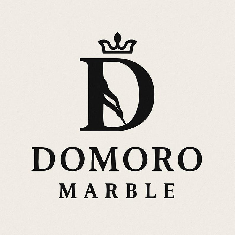 May include: A black logo on a light beige background featuring a large letter D with a crown icon on top and a silhouette of a leg integrated into the letter. Below the letter D, the text reads DOMORO MARBLE in a bold, black serif font.