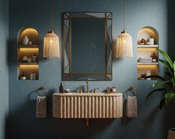 May include: A bathroom interior with a teal wall, featuring a large mirror with a gold frame, a beige vanity, and two pendant lights with fringed shades. The room includes built-in shelves and a potted plant.