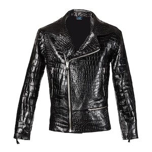 May include: Black leather jacket with a crocodile skin texture. The jacket features a diagonal zipper closure, a notched collar, and a small zippered pocket on the front. The sleeves have zippers at the cuffs.