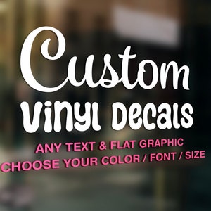 May include: White vinyl decal with the text "Custom Vinyl Decals" in a cursive font. Below the text is the phrase "ANY TEXT & FLAT GRAPHIC" and "CHOOSE YOUR COLOR / FONT / SIZE" in a smaller font.