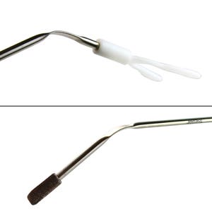 May include: A close-up of a medical instrument with a brown brush on one end and a white plastic tip on the other end. The instrument is made of metal and has a curved shape. The text "C-CX2-2H6" is printed on the metal.