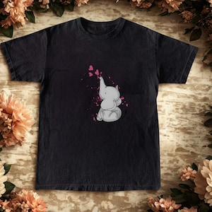 Unisex Heavy Cotton Tee, Cute Elephant T-Shirt, Baby Elephant Blowing Hearts, Animal Lover Gift, Soft Graphic Tee, Minimalist Elephant Shirt