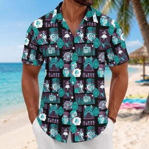 May include: A short-sleeved button-down shirt featuring a repeating graphic print of characters in top hats, ornate mansions, and oval frames. The design uses a colour palette of teal, purple, and black, with a standard collar and front buttons.