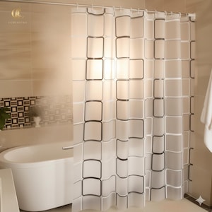 May include: A clear shower curtain with a repeating pattern of black-outlined squares. The curtain hangs from a metal rod above a white bathtub. The bathroom has beige tile walls.