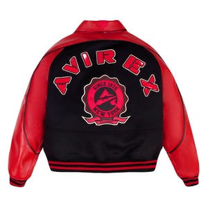 May include: Red and black varsity jacket with the text "AVIREX" across the back shoulders. The back of the jacket features a circular emblem with the text "SINCE 1975 NEW YORK CLASSIC". The jacket has red leather sleeves and a black body.