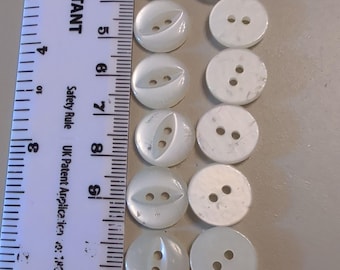 19 x 11 mm krämfärgade fisheye-knappar