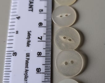 8 x 16 mm knappar med klar citronfärgad fiskögonmotiv