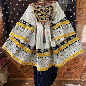 White and Navy Traditional Afghan Dress with Intricate Embroidery and Flared Sleeves