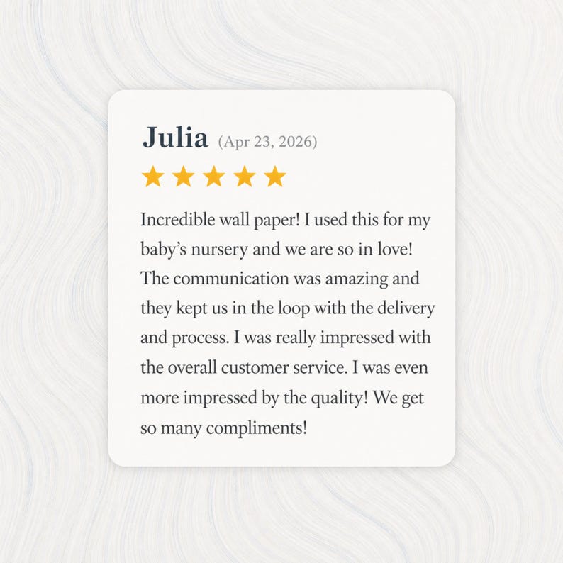 May include: A customer review card with the name "Julia" and the date "Apr 23, 2026". The review includes five gold stars and text praising the wallpaper used in a baby's nursery. The review highlights the quality and customer service.