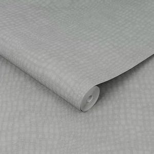 May include: A roll of light gray wallpaper with a textured crocodile skin pattern. The wallpaper is partially unrolled, revealing the pattern and the paper's core. The design features a grid-like texture.