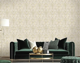 May include: A living room scene featuring a dark green velvet sofa with decorative pillows, a gold-toned coffee table, and a matching ottoman. The background is a cream-colored wallpaper with a gold damask pattern.