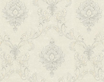 May include: Cream-colored wallpaper with a repeating pattern of ornate, stylized floral and scroll designs in shades of gray and silver. The wallpaper has a textured appearance, adding depth to the classic damask motif.